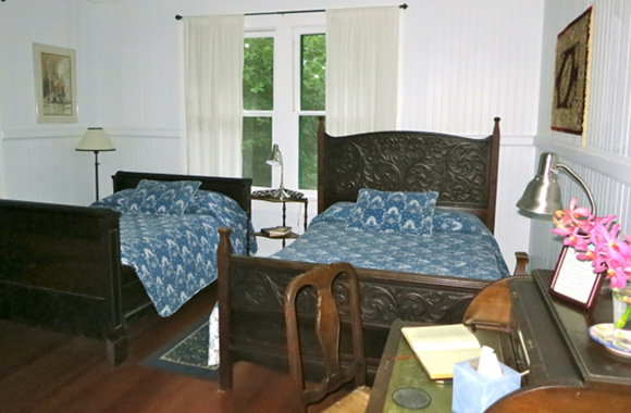 Waipio Wayside, Plantation Room, two bed and a table